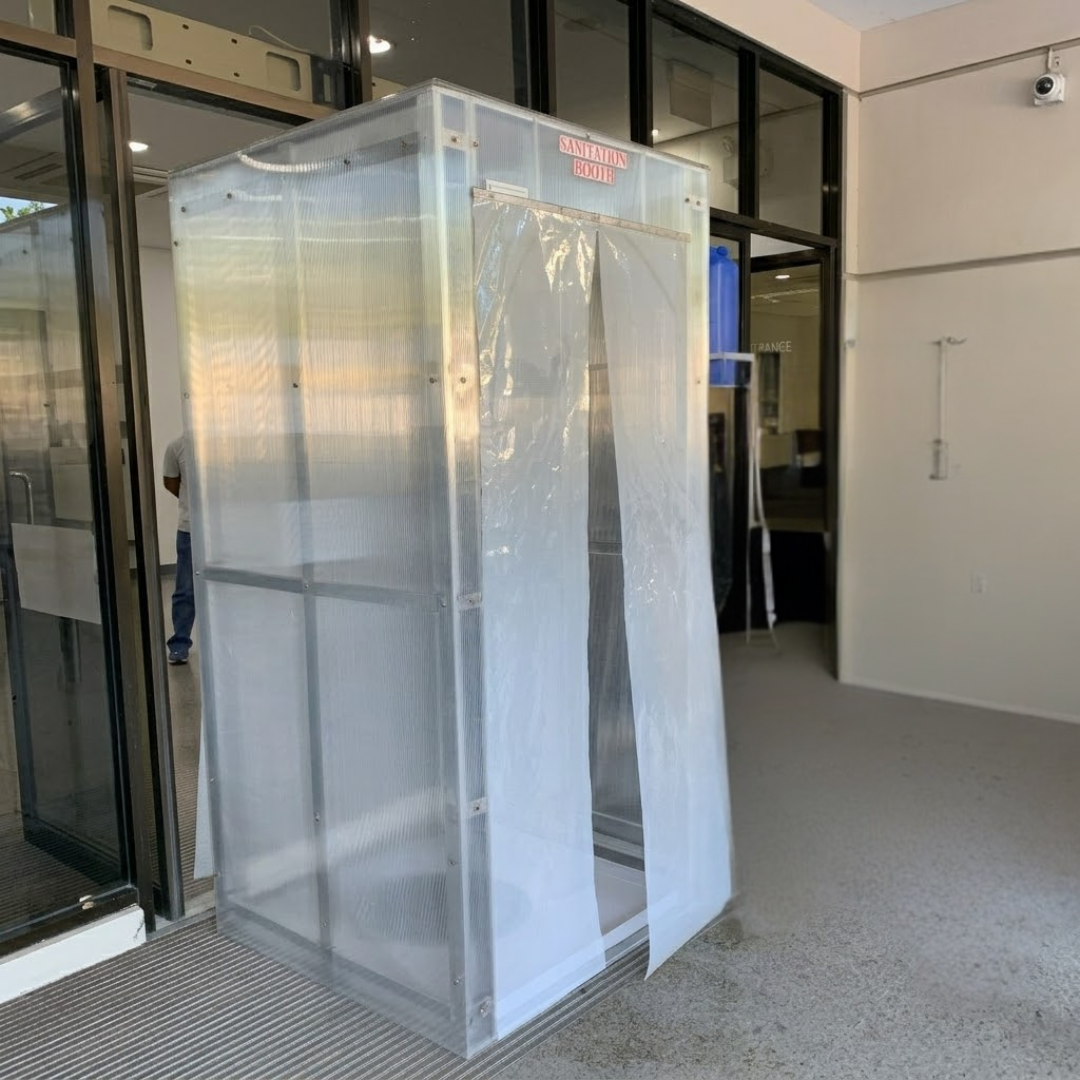 Completed sanitation booth installed at a site entry point for controlled access during the pandemic.